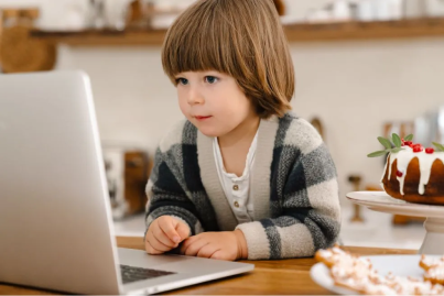 child playing foundations a-z phonics program on computer