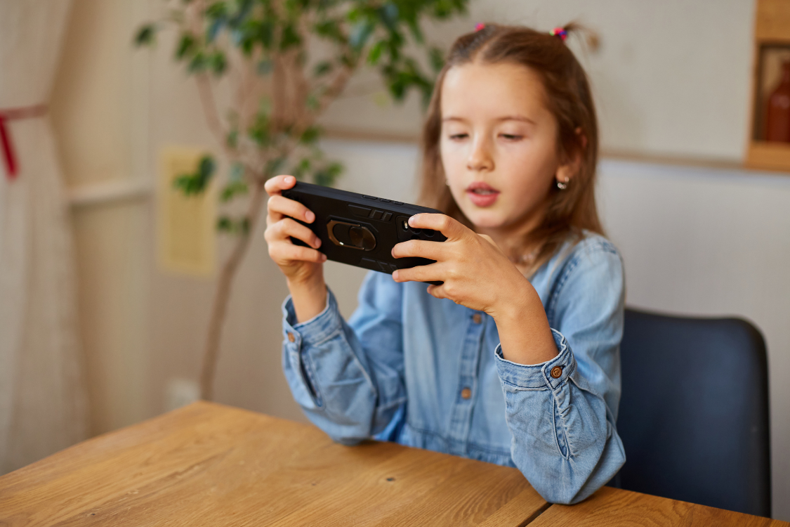 girl playing Chimp Fu Syllables App on tablet