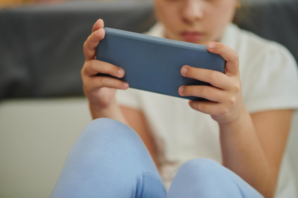 child playing on smartphone app